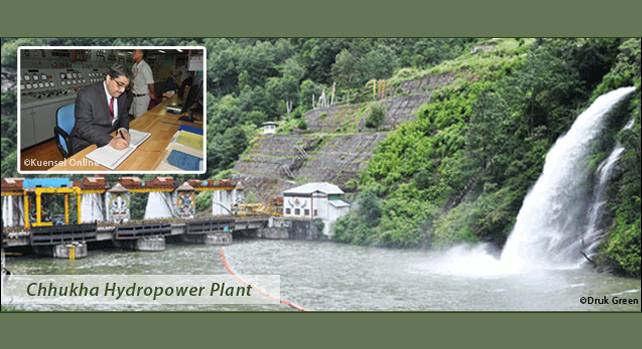 Ambassador Bambawale signs guest book in Chhukha Hydropower Plant.